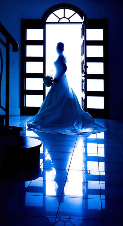 Bride by an Open Door Wedding Photography image